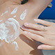 Mother Drawing Sun On Son's Back With Sunscreen - VideoHive Item for Sale