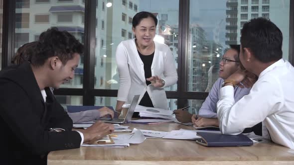 Asian Business People Discuss Marketing Strategy alt