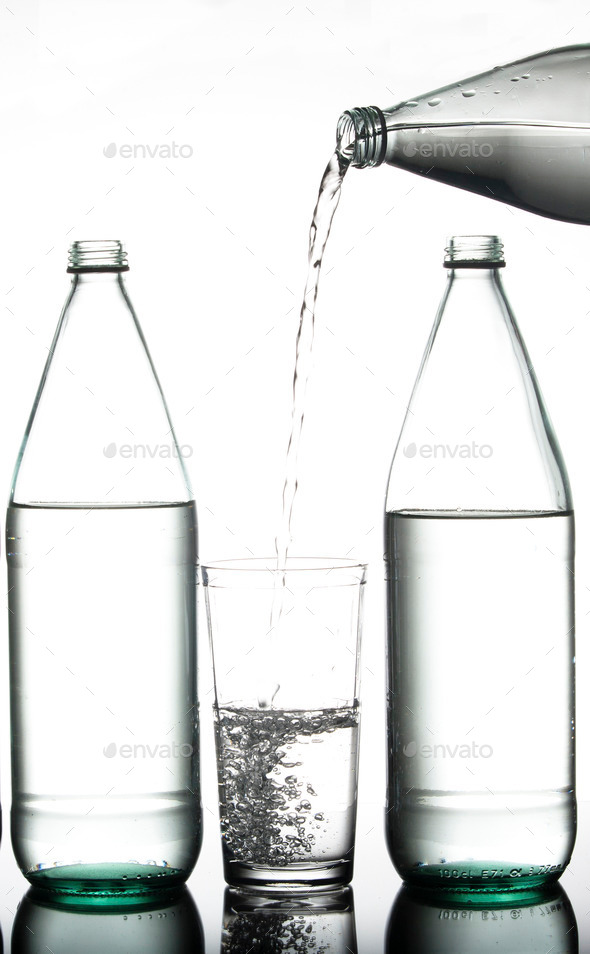 Pouring water from a bottle.