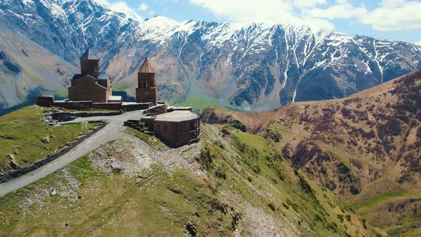 Aerial View of Gergeti Trinity Church and Stepantsminda Georgia alt