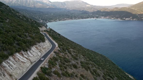 Car Travel Concept Aerial View of Mountain Road Near Sea at Lefkada Island