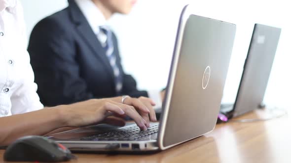 Business People Typing On Laptop In The Office