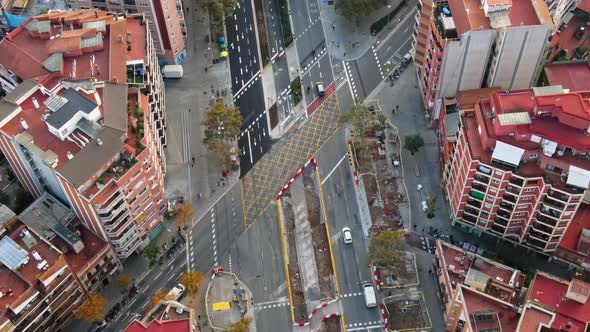 Aerial drone view of Barcelona, Spain. Block with residential buildings, roads with cars alt