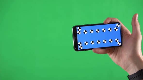 Closeup Footage of a Smartphone in Horizontal Orientation with Tracking Points and Man Sliding Pages alt