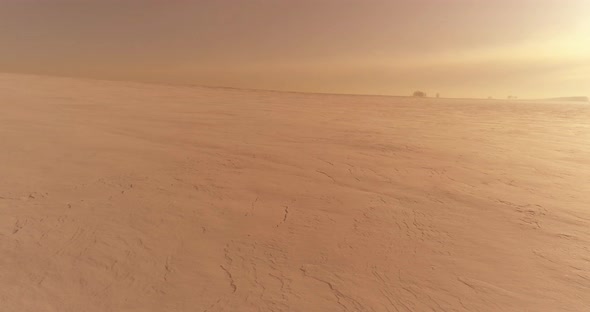 Aerial View of Cold Winter Landscape Arctic Field Trees Covered with Frost Snow Ice River and Sun alt