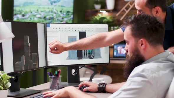 Architects Using 3D Software To Discuss New Building Mock Ups alt