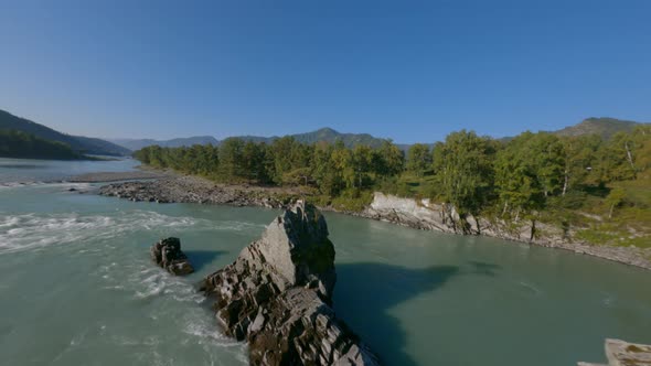 Aerial Rotation Shot Natural High Tree on Natural Cliff Stone Texture Fast Mountain River Flow alt