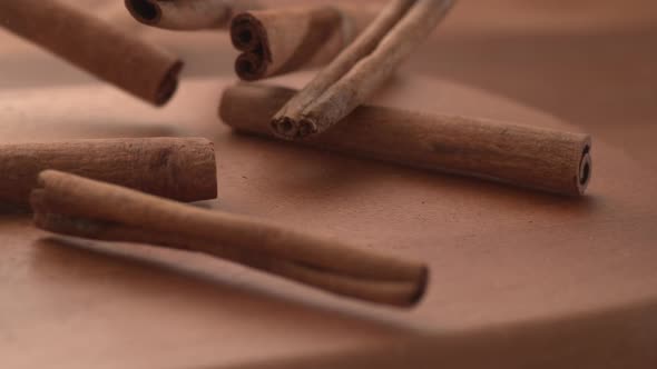 Cinnamon Sticks falling onto wooden surface in super slow motion.  Shot on Phantom Flex 4K high spee