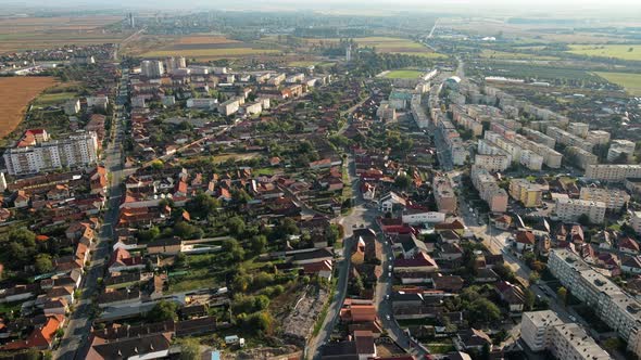 Aerial drone view of the Fagaras, Romania. Multiple residential buildings, roads with cars alt