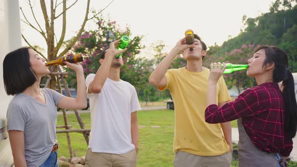 Group of Asian man and woman friends are having holiday party trip outdoor in the evening together. alt