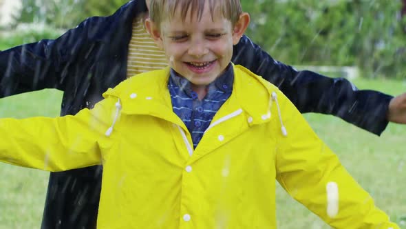 Happy Brothers Playing in Rain alt
