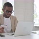 African Man Making Successful Online Payment on Laptop - VideoHive Item for Sale