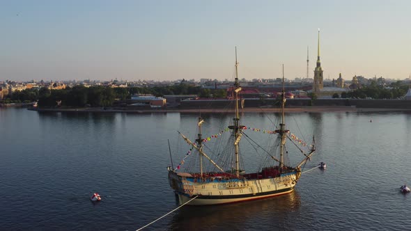 Aerial Morning Urban Landscape with a Replica of the Ancient Frigate Poltava Against the Background alt