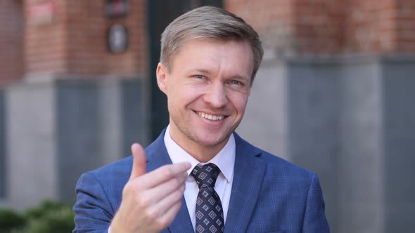 Inviting Gesture by Businessman alt