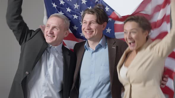 Group of Happy Business People with American Flag Looking Away Smiling alt