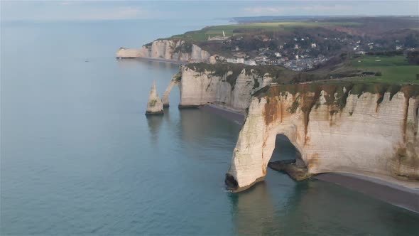 Etretat, France, Video - Aerial view of the Etretat chalk cliffs during a sunny day