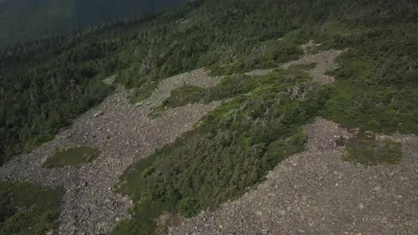 Aerial footage of White Cap Mountain situated within the watershed of the Pleasant River located in alt