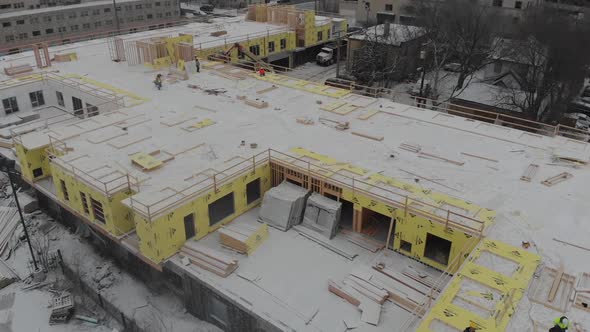 Construction building winter time Minnesota framing alt