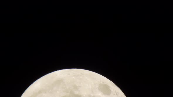 A full moon supermoon rises. alt