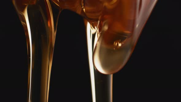 Thick honey dripping. Slow Motion. alt