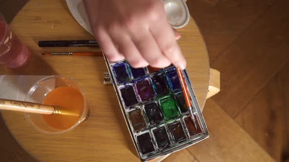 Artist Mixes Paints on the Palette Before Painting a Picture Makes Piece of Art
