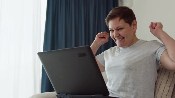 Happy Older Pensioner Web Surfing Information alt