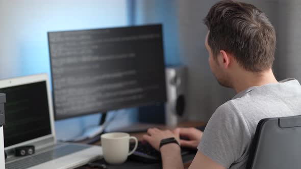 Male Programmer Working at Home