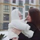 In Winter, A Mother Walks Down The Street With A Child In Her Arms - VideoHive Item for Sale