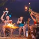 Group of Asian young man and woman having party on the beach at night. - VideoHive Item for Sale