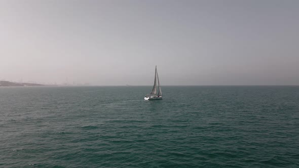 Aerial View of a Sailing Boat in the Sea