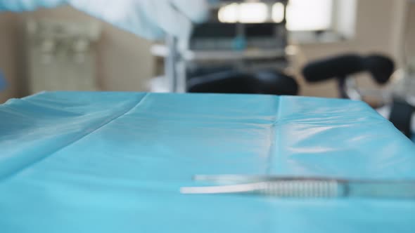 A Table of Medical Tools are Placed Upon a Table in Preparation for Robotic alt