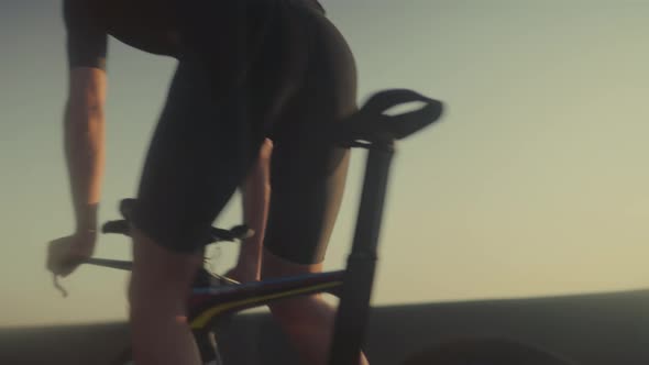 Triathlete Cyclist Training On Bicycle. Fit Athlete Sport Workout Training Cycling Triathlon. alt