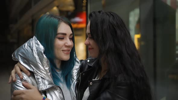 Tender LGBT Couple Hugs and Smiles in Public alt
