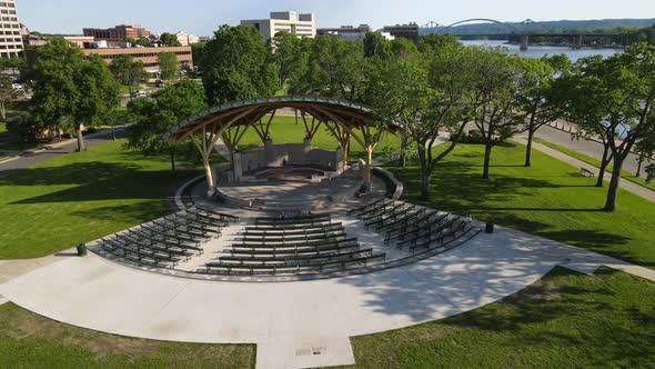 Drone view of event venue in park in La Crosse, Wisconsin, with Mississippi River along the side.