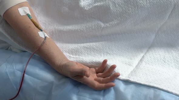 Terminally Ill Patients Hand Convulsing, Dropper in Arm, Person Suffering Pain