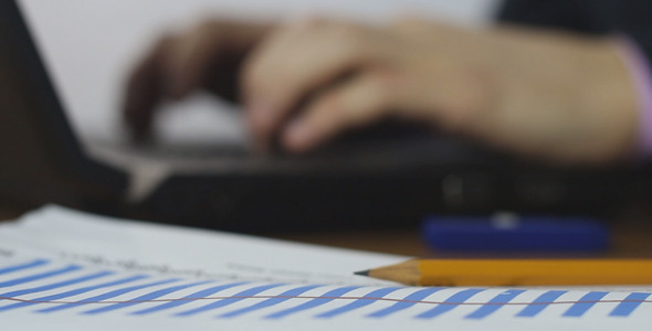 Businessman Typing on Laptop alt