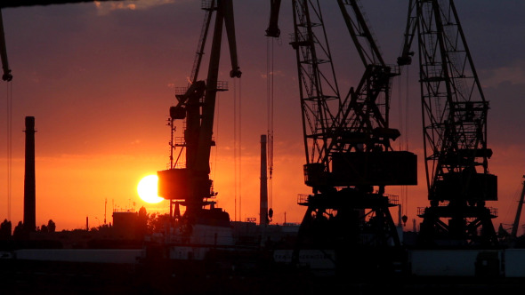 A Cargo Cranes in the Port at Sunset