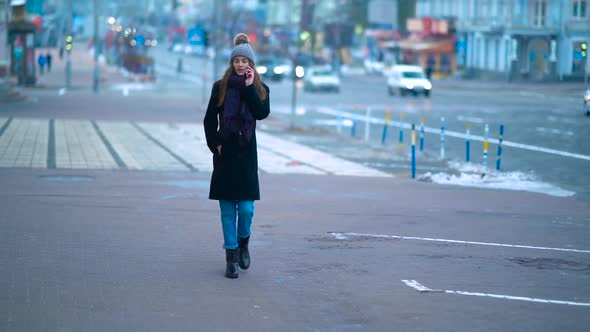 Girl Walking Down The Street Winter alt