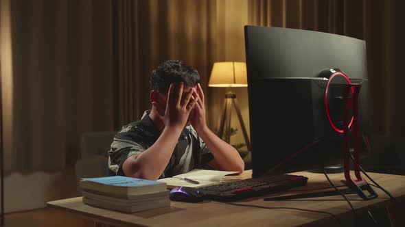 Teenage Boy Headache While Distance Learning With Computer From Home alt