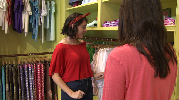 Women Looking At Different Items At A Children's Boutique (4 Of 4)