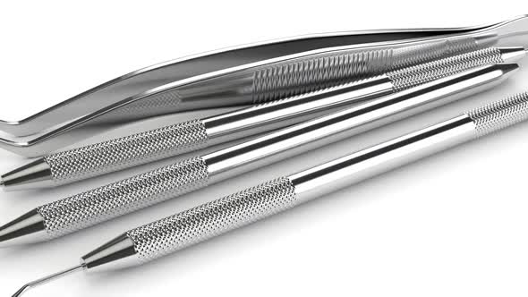 Dental diagnostic instruments over white background alt