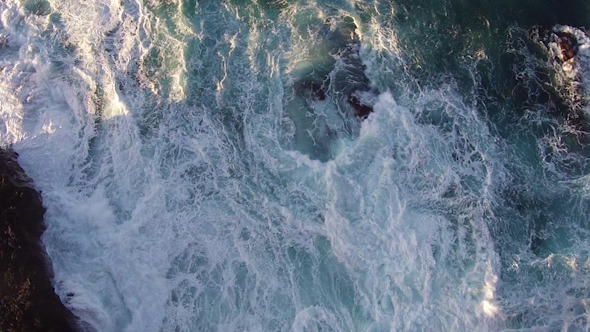 Flying over the Rocks and Ocean Waves alt