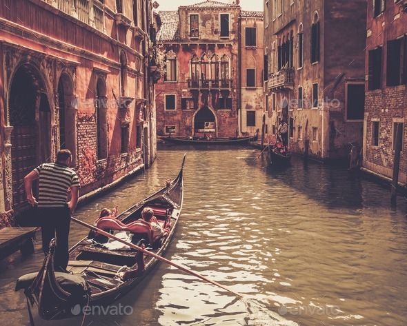 Traditional Venice gondola ride - Stock Photo - Images