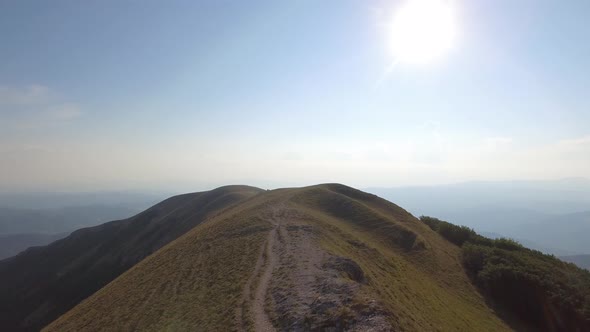Drone view of two friends hiking in the Apennines, Umbria, Italy alt