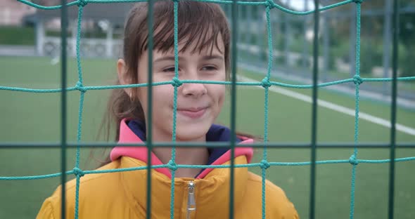 Happy teen on playground.  alt