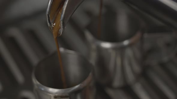 Close-up of Espresso From Coffee Machine. Professional Barista Coffee Brewing in Coffee Shop. alt