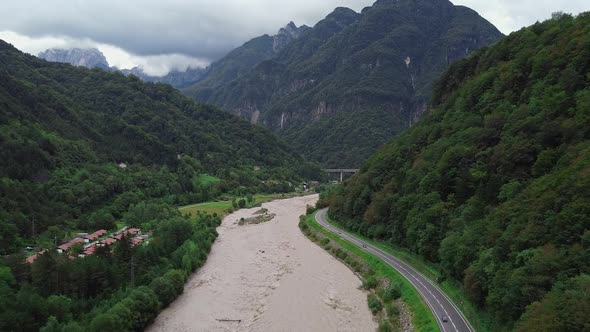 Aerial View of River in the Valley Between Mountains alt