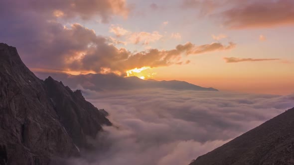 Mountains and Moving Clouds at Sunset. Aerial Hyper Lapse alt