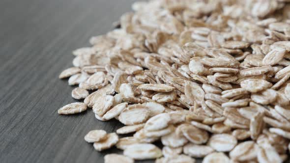 Pile of groats  made nutritious food   4K 2160p 30fps UltraHD panning  footage - Dehydrated rye flak alt