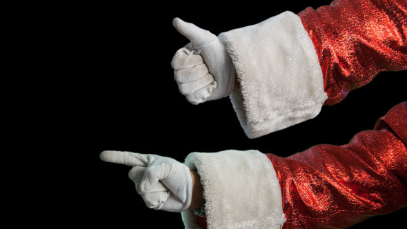 Santa's Hand Shows The Direction And Thumbs Up
